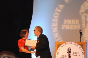 MNA President Kevin Anderson presents Mirja Hanson with a 2013 President's Citation
